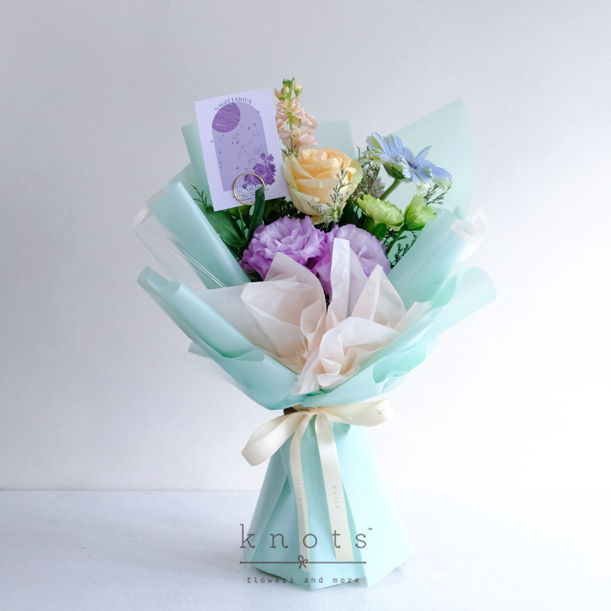 Boundless Archer (Peach Rose and Blue Sprayed White Gerbera Bouquet)