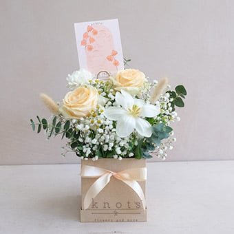 Gertrude (Peach China Roses, and White Tulip Box Arrangement)