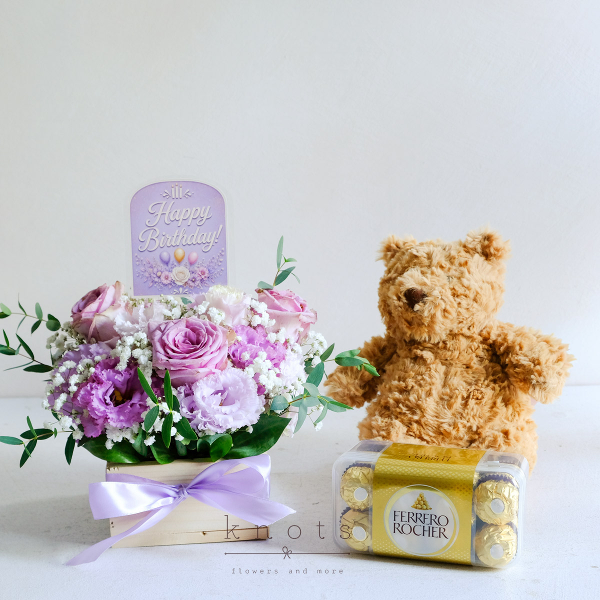 Sweet Birthday Wishes (Purple Roses Arrangement with Gifts)