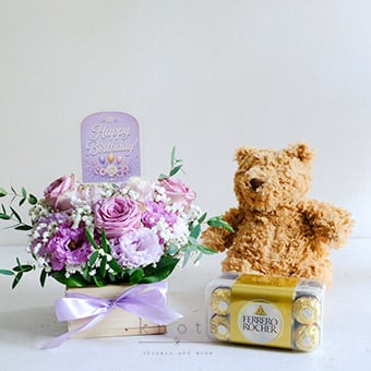 Sweet Birthday Wishes (Purple Roses Arrangement with Gifts)