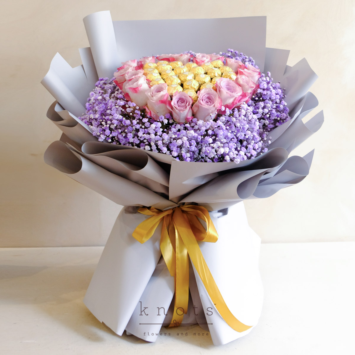 Jenny (17 Purple Roses with 24 Ferrero Chocolate Bouquet)