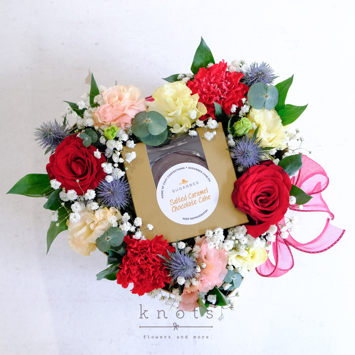 Heartfelt Indulgence (Red Roses and Carnations Arrangement with Mini Cake)