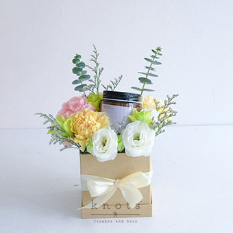 Serene Blooms (Peach and Pink Carnation Arrangement with Candle)