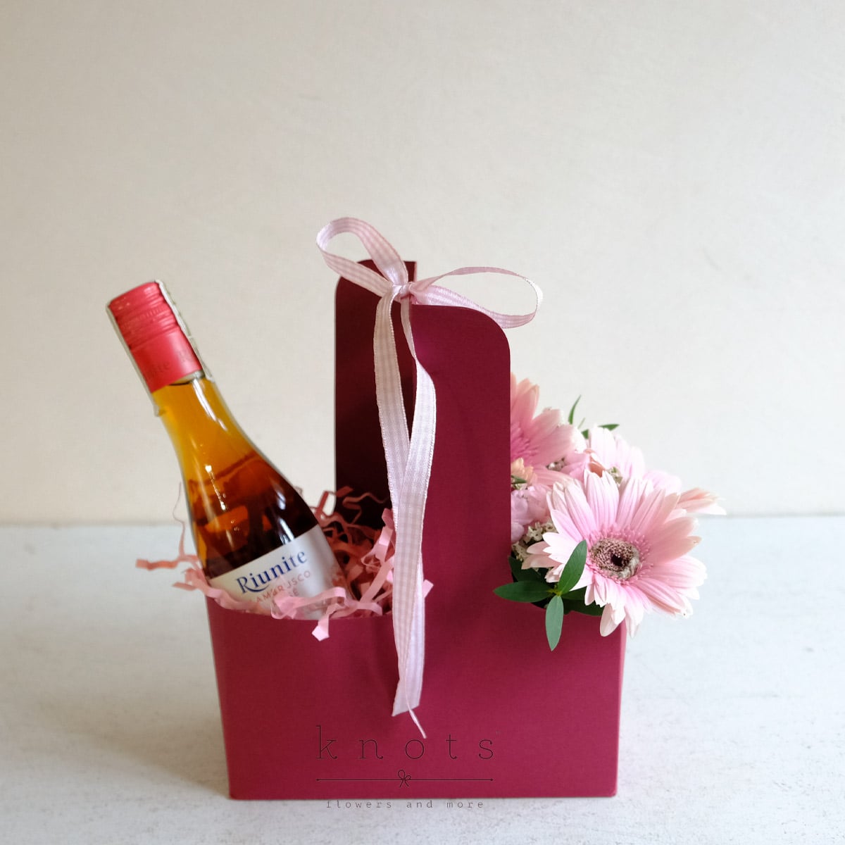 Rosy Cheers (Pink Gerbera Arrangement with Wine)