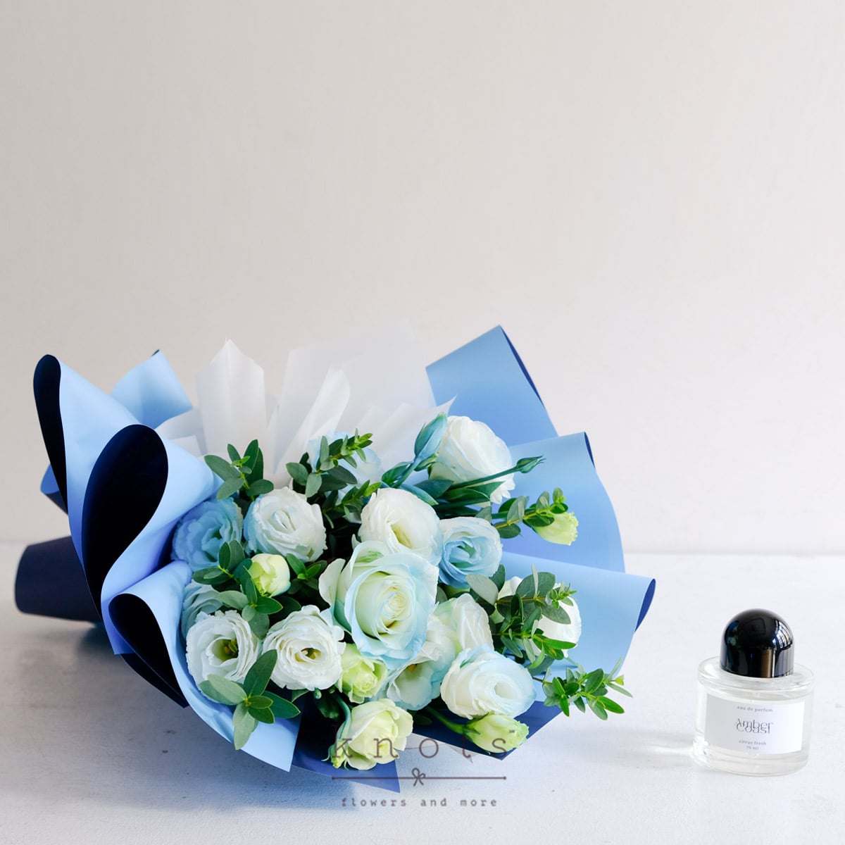 Coastal Breeze (Blue Sprayed White Rose Bouquet with Perfume)
