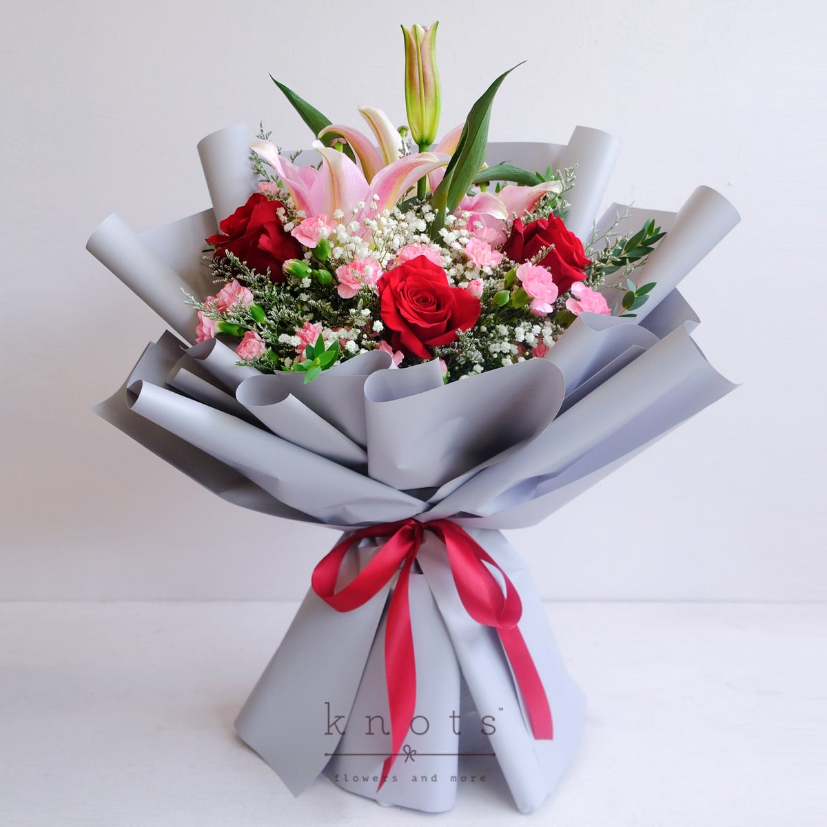 Regal Hearts (Red Ecuadorian Roses & Pink Lily Bouquet)