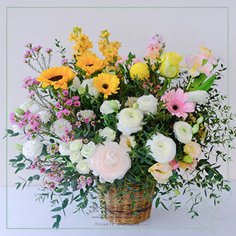 Selfless Devotion (Ranunculus and Gerbera Arrangement)
