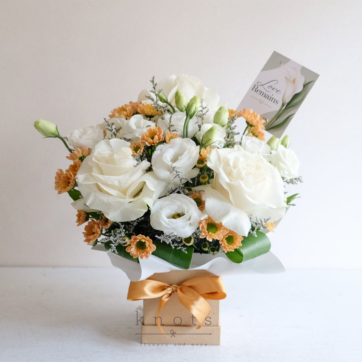 Heavenly Embrace (White Ecuadorian Roses Sympathy Arrangement)