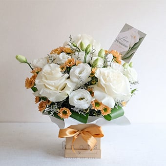 Heavenly Embrace (White Ecuadorian Roses Sympathy Arrangement)