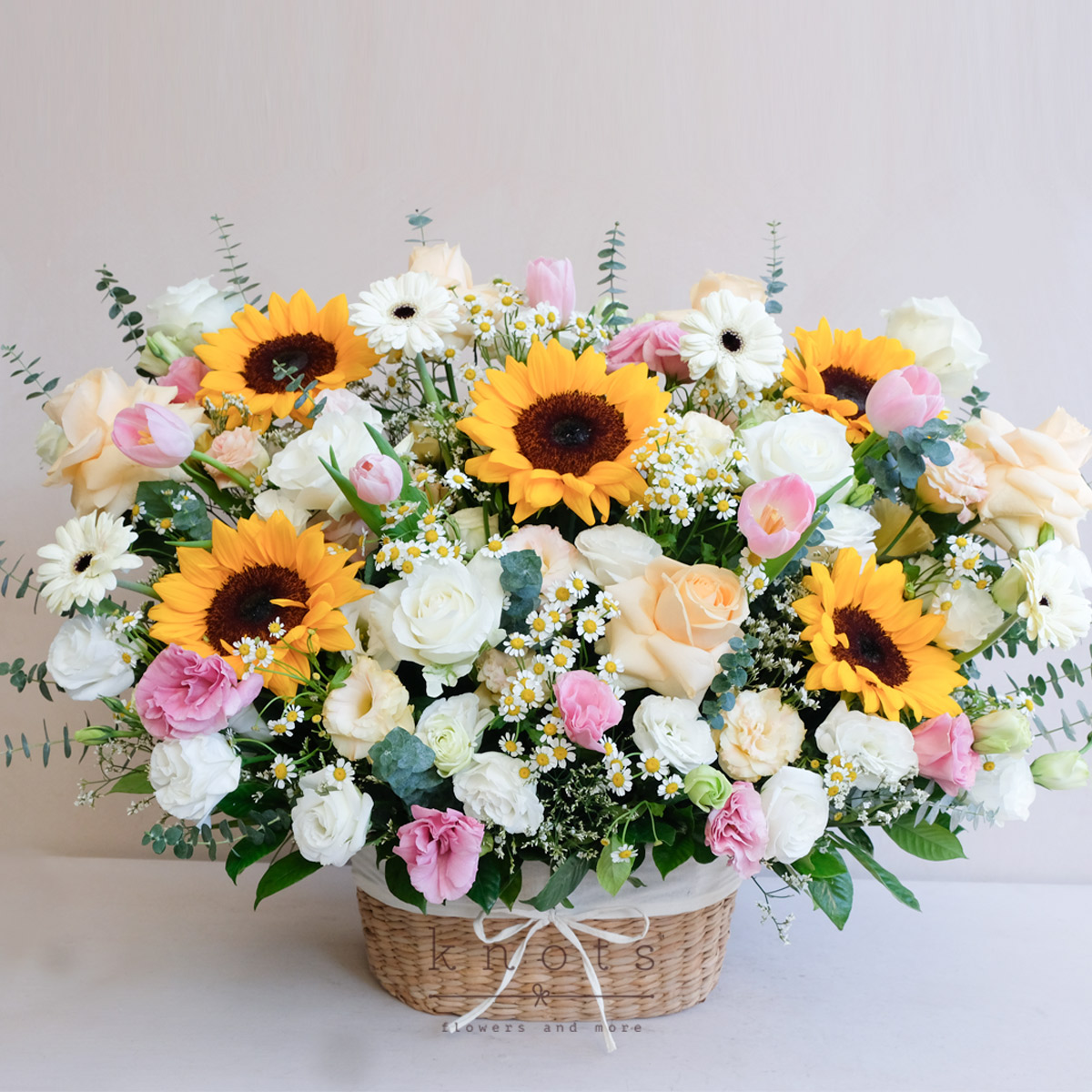 Sunshine Ensemble (Sunflowers, tulip and Rose Arrangement)