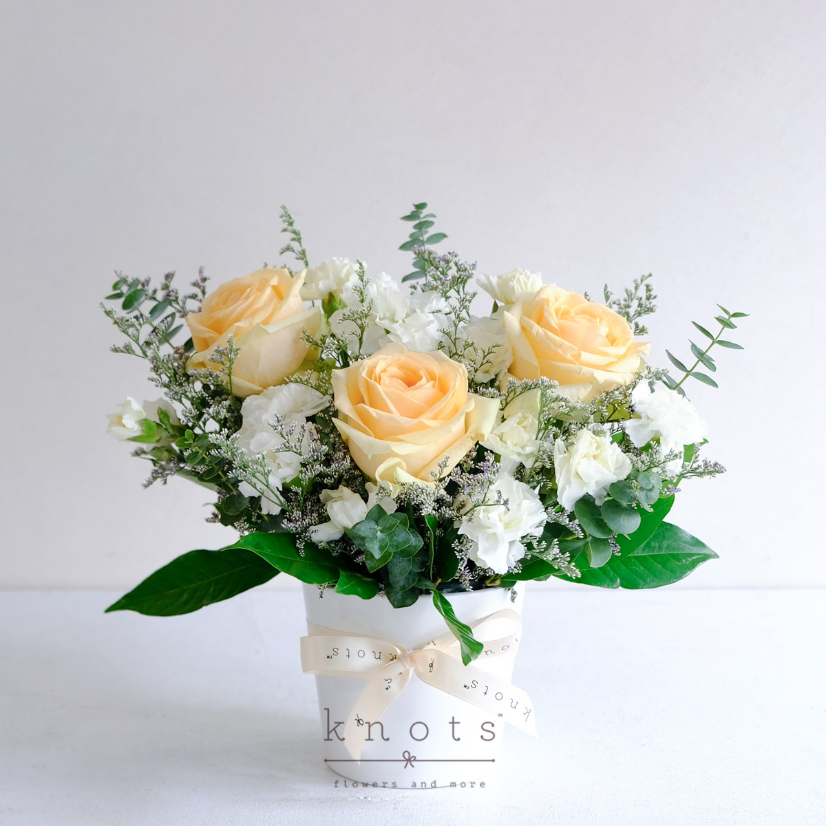 Murmurs of Confidants (Peach Roses & White Carnations Arrangement)