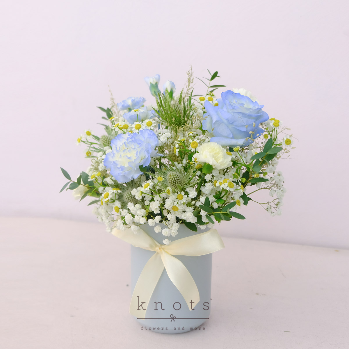 AR2512-Oceans-Mist-Blue-White-Roses-and-Carnation-ArrangementA_1200