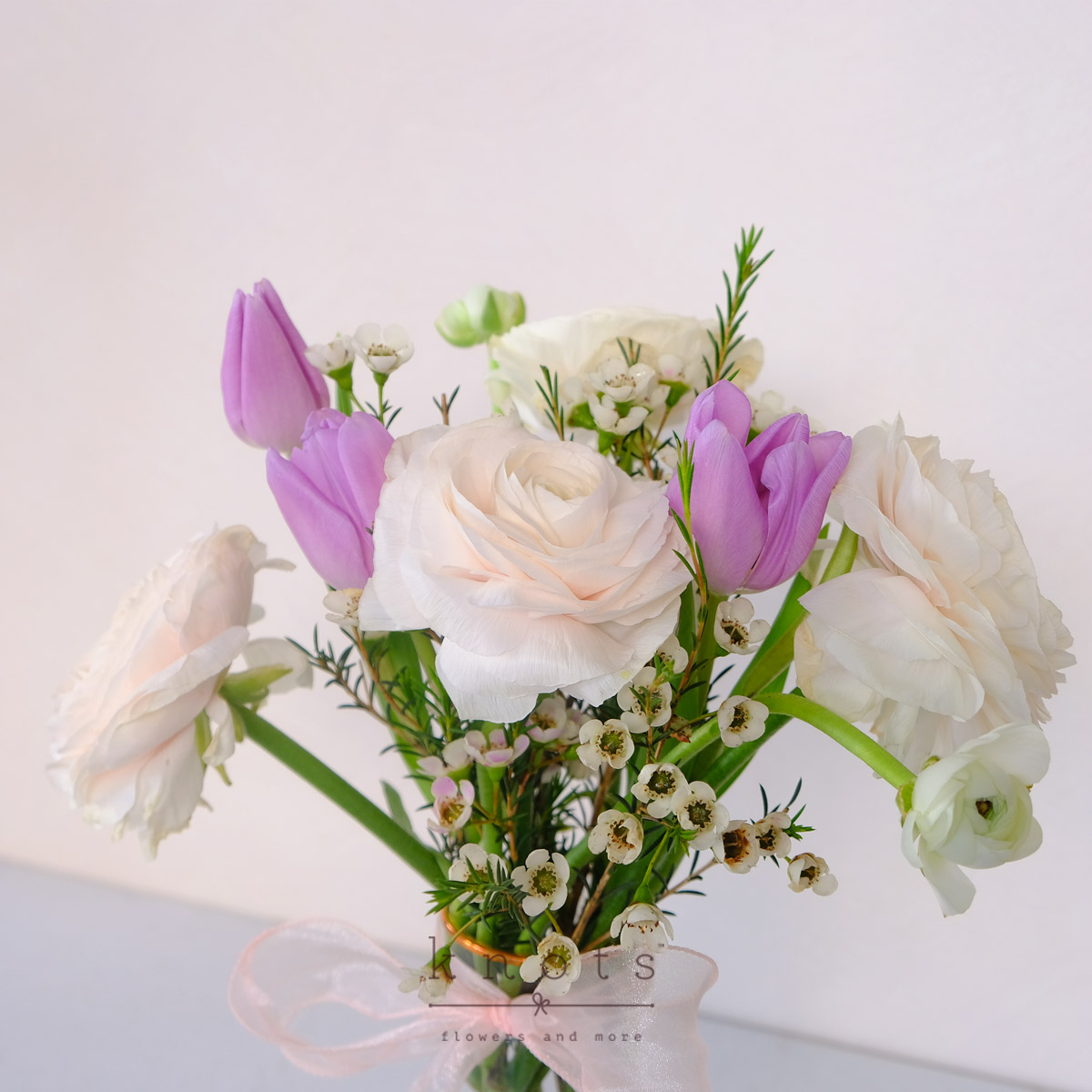 AR2532-Unwavering-Presence-Ranunculus-and-Gerbera-ArrangementB_1200