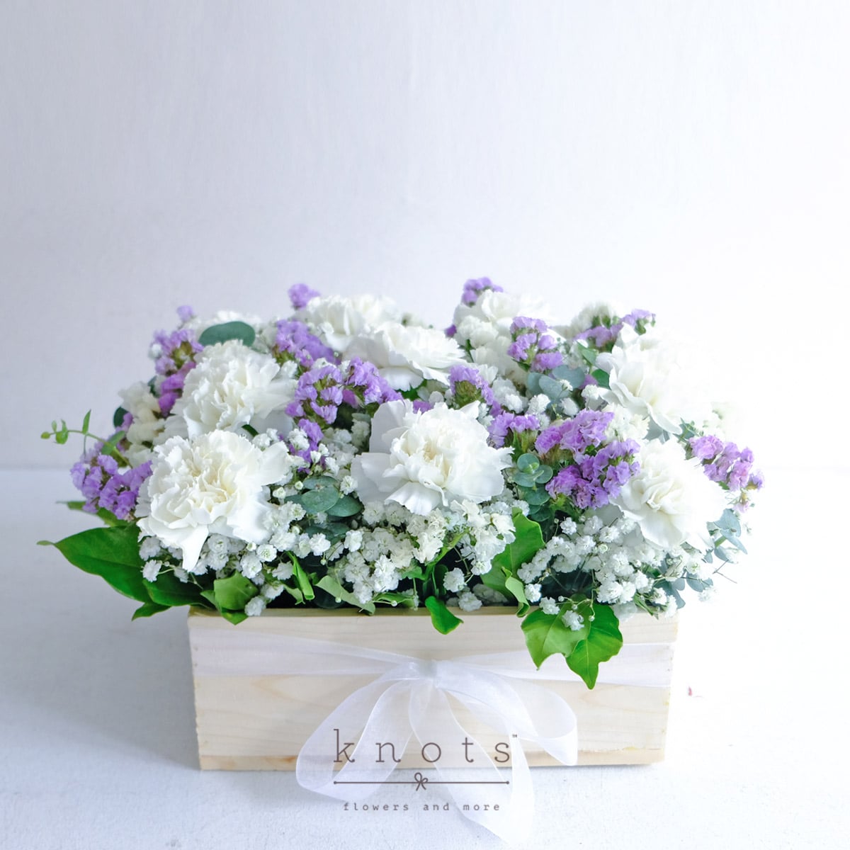 Gentle Comfort (White Carnation and Purple Statice Arrangement)