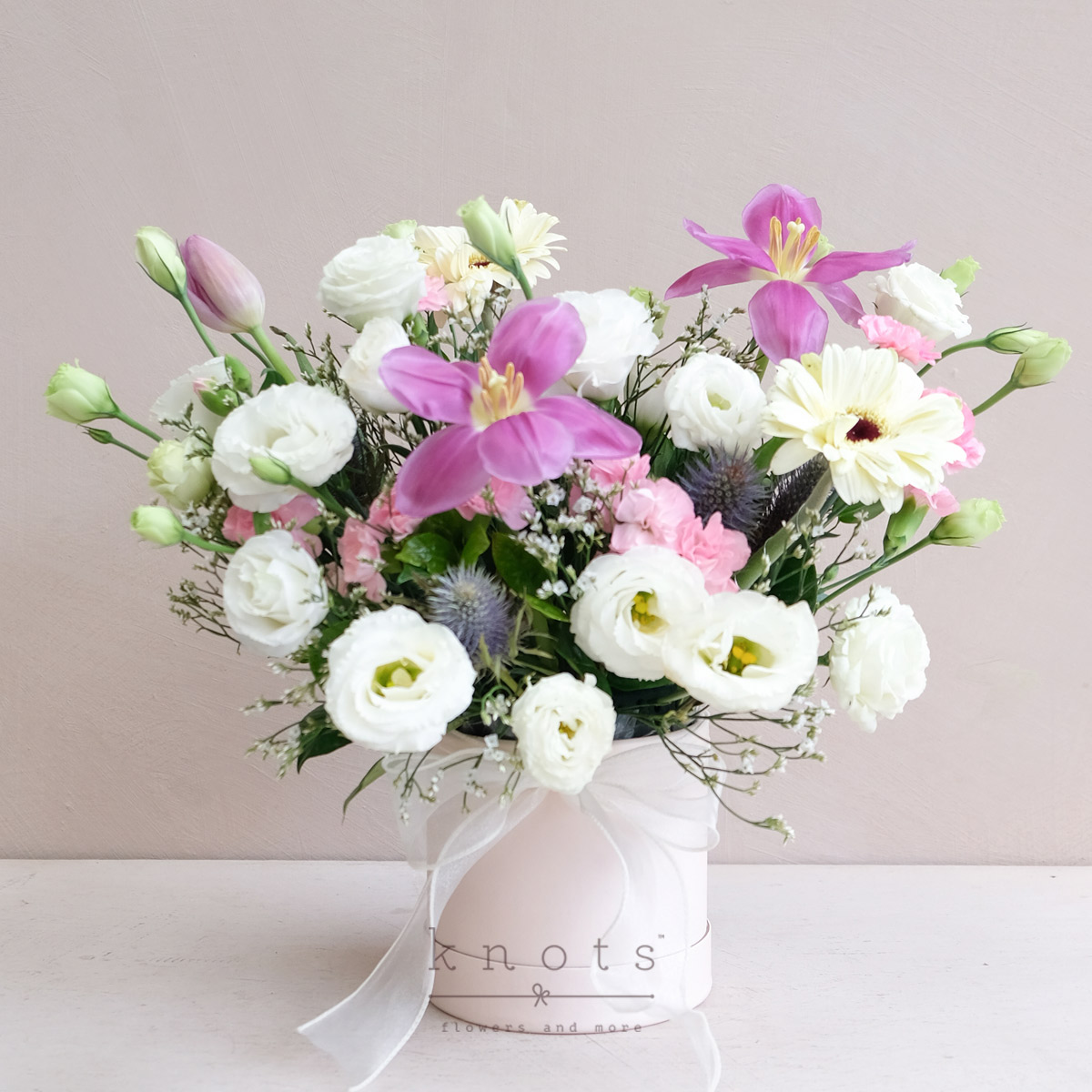 Rhianne (Purple Tulips, And White Gerbera Arrangement)