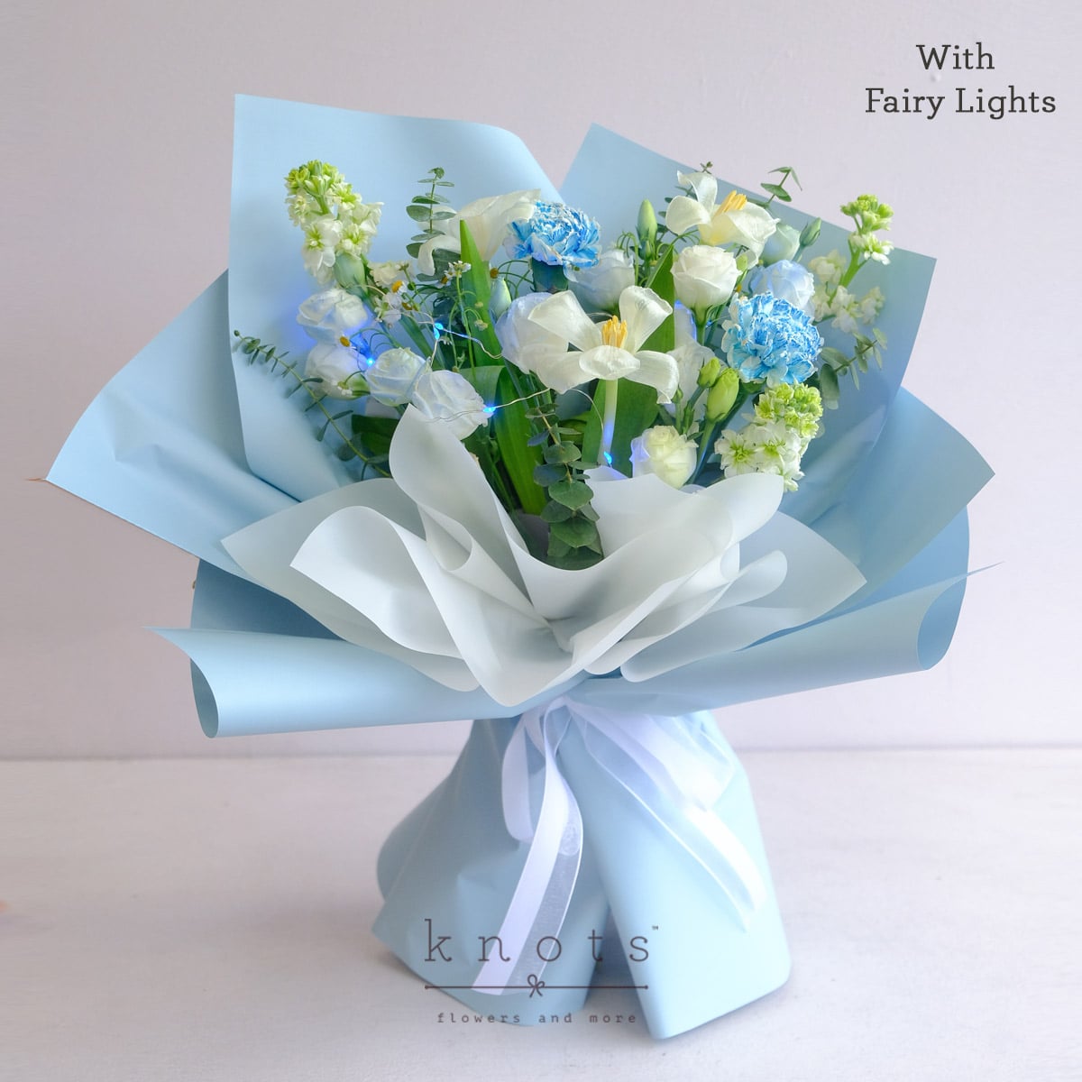 Polaris (White Tulips and Blue Dyed White Carnation Bouquet w/ Fairy Lights)