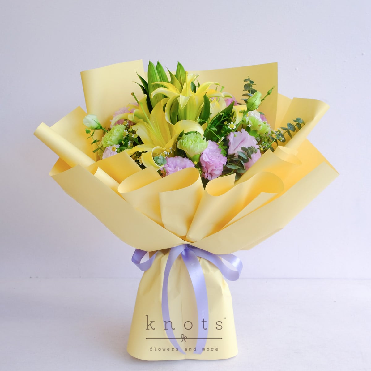 Daphne Blake (Yellow-Sprayed White Lily and Green Carnation Bouquet)