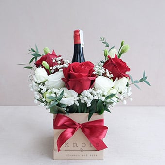 Red at Home (Red Ecuadorian Roses Arrangement w/ Wine)